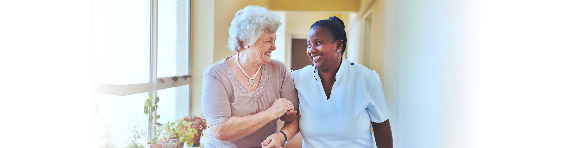 talking caregiver with senior woman